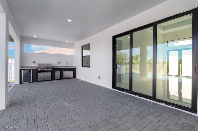 1040 NE 11th Ave, Cape Coral, FL 33909 - view of patio featuring area for grilling and beverage cooler