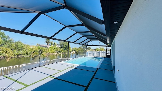 1040 NE 11th Ave, Cape Coral, FL 33909 - view of pool with a water view, glass enclosure, and a patio area
