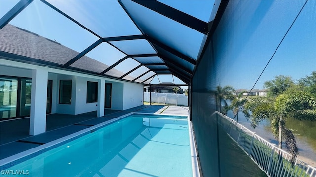 1040 NE 11th Ave, Cape Coral, FL 33909 - view of swimming pool featuring a lanai and a patio area