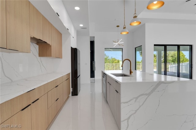 1040 NE 11th Ave, Cape Coral, FL 33909 - kitchen with modern cabinets, freestanding refrigerator, decorative backsplash, light brown cabinets, and recessed lighting