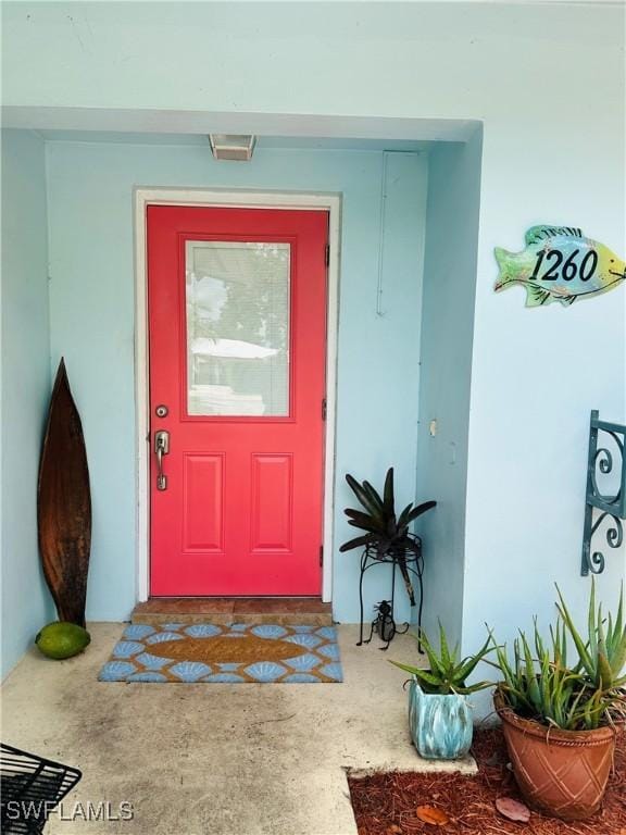 1260 26th Ave N, Naples, FL 34103 - doorway to property with stucco siding