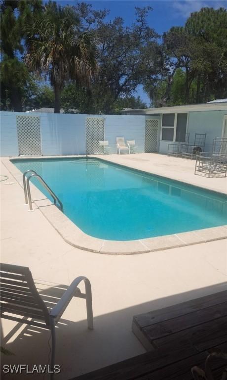 1260 26th Ave N, Naples, FL 34103 - view of pool with a patio