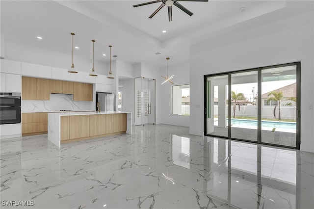 834 NW 2nd St, Cape Coral, FL 33993 - kitchen featuring modern cabinets, freestanding refrigerator, recessed lighting, plenty of natural light, and double oven