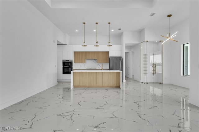 834 NW 2nd St, Cape Coral, FL 33993 - kitchen with modern cabinets, light marble finish flooring, recessed lighting, freestanding refrigerator, and light countertops
