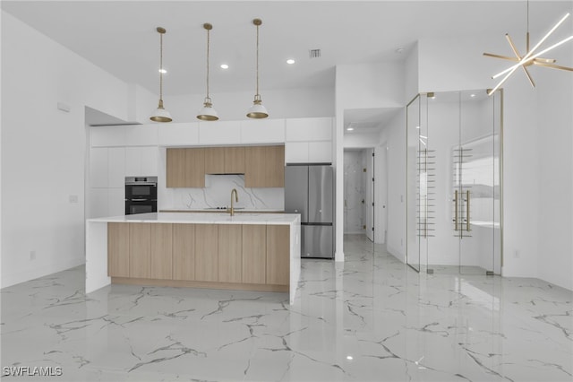 834 NW 2nd St, Cape Coral, FL 33993 - kitchen with stainless steel appliances, modern cabinets, light marble finish flooring, light countertops, and recessed lighting