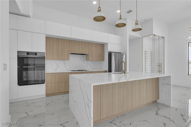 834 NW 2nd St, Cape Coral, FL 33993 - kitchen with oven, freestanding refrigerator, modern cabinets, light marble finish floors, and recessed lighting