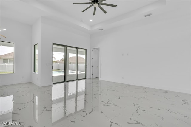 834 NW 2nd St, Cape Coral, FL 33993 - unfurnished room with ceiling fan, marble tiled flooring, and recessed lighting