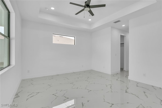 834 NW 2nd St, Cape Coral, FL 33993 - empty room featuring recessed lighting, light marble finish flooring, a raised ceiling, and ceiling fan