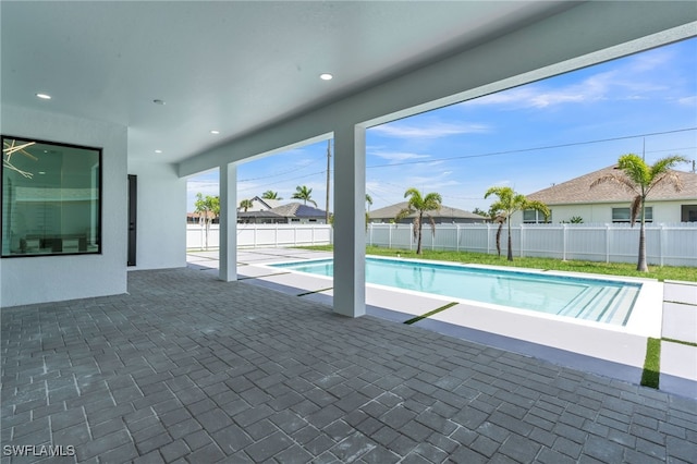 834 NW 2nd St, Cape Coral, FL 33993 - view of swimming pool featuring a patio and a fenced backyard
