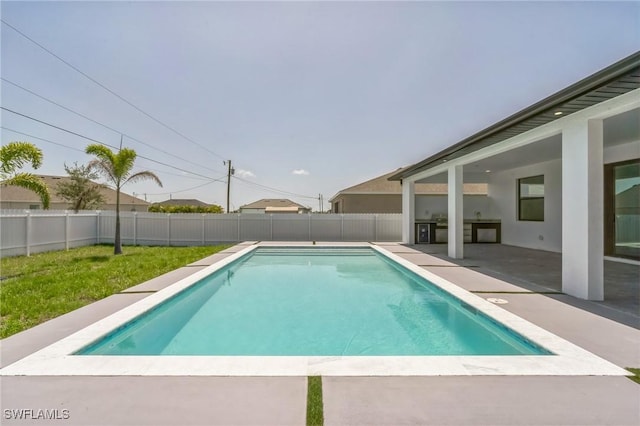 834 NW 2nd St, Cape Coral, FL 33993 - view of swimming pool featuring a fenced backyard and a patio