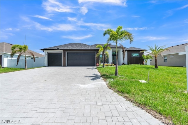 834 NW 2nd St, Cape Coral, FL 33993 - view of front of property with decorative driveway and an attached garage