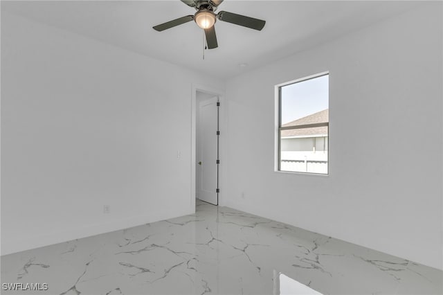 834 NW 2nd St, Cape Coral, FL 33993 - spare room with light marble finish floors and ceiling fan