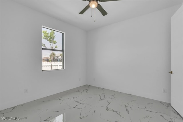 834 NW 2nd St, Cape Coral, FL 33993 - unfurnished room featuring light marble finish floors and ceiling fan