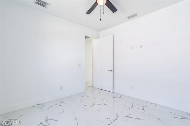 834 NW 2nd St, Cape Coral, FL 33993 - unfurnished room with a ceiling fan and light marble finish flooring