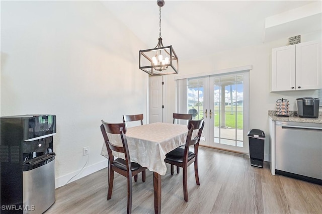 2508 Tropicana Pkwy W, Cape Coral, FL 33993 - dining area with a chandelier, french doors, and light wood-style floors