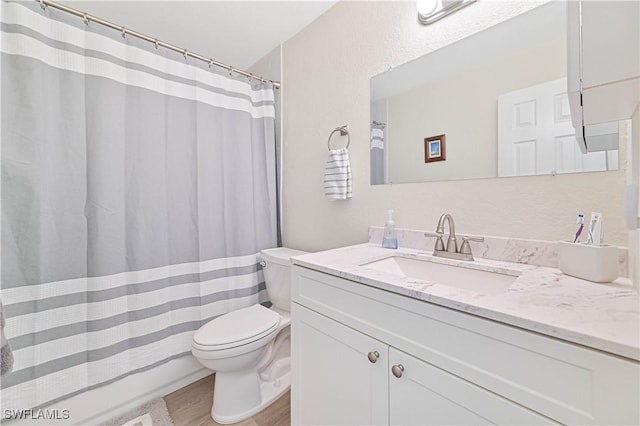 2508 Tropicana Pkwy W, Cape Coral, FL 33993 - bathroom featuring vanity, wood finished floors, and curtained shower