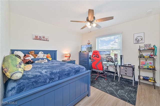2508 Tropicana Pkwy W, Cape Coral, FL 33993 - bedroom featuring wood finished floors and a ceiling fan