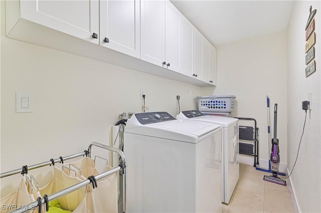 2508 Tropicana Pkwy W, Cape Coral, FL 33993 - laundry area with washing machine and dryer, cabinet space, and light tile patterned floors
