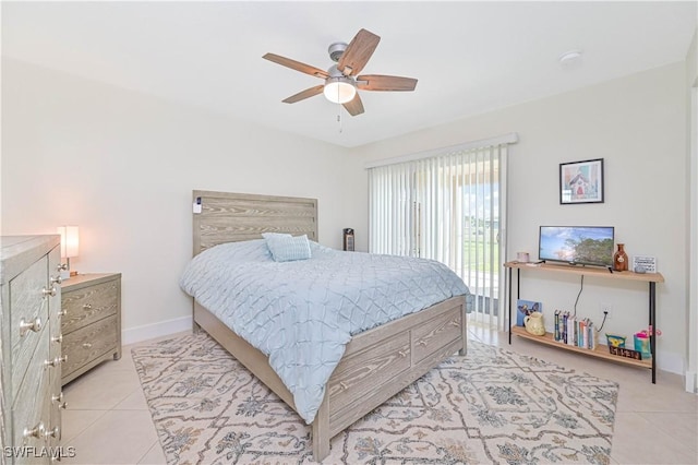 2508 Tropicana Pkwy W, Cape Coral, FL 33993 - bedroom with light tile patterned flooring, a ceiling fan, and access to exterior