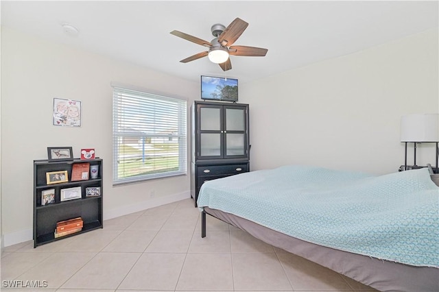 2508 Tropicana Pkwy W, Cape Coral, FL 33993 - bedroom featuring light tile patterned floors and ceiling fan