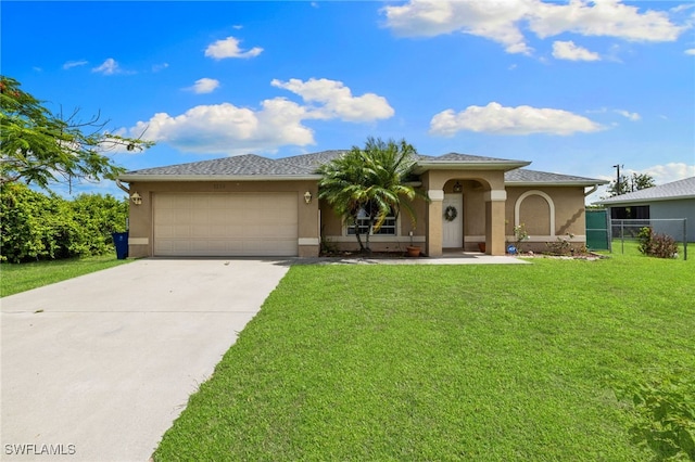 3206 8th St SW, Lehigh Acres, FL 33976 - view of front of home featuring stucco siding, driveway, and an attached garage