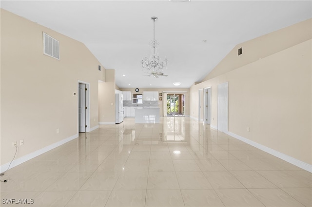 3206 8th St SW, Lehigh Acres, FL 33976 - unfurnished room with lofted ceiling, a chandelier, light tile patterned floors, and recessed lighting
