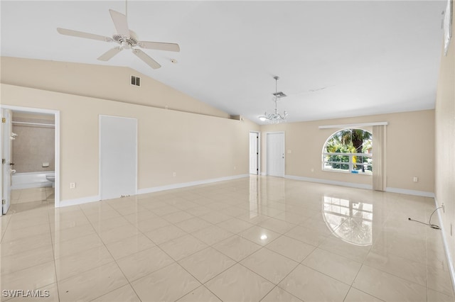 3206 8th St SW, Lehigh Acres, FL 33976 - empty room featuring light tile patterned floors, lofted ceiling, a chandelier, and ceiling fan