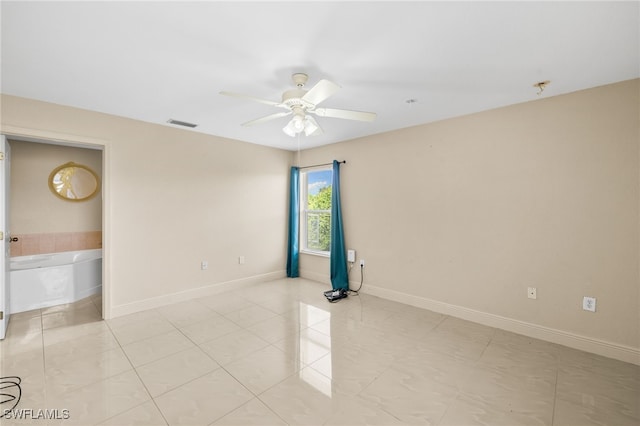 3206 8th St SW, Lehigh Acres, FL 33976 - empty room featuring a ceiling fan and light tile patterned floors