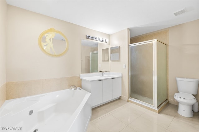 3206 8th St SW, Lehigh Acres, FL 33976 - bathroom featuring vanity, a shower stall, a garden tub, and tile patterned floors