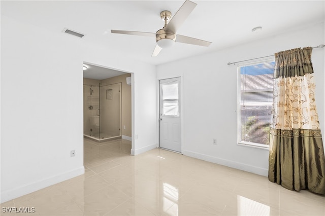 3206 8th St SW, Lehigh Acres, FL 33976 - empty room with plenty of natural light, a ceiling fan, and light tile patterned flooring