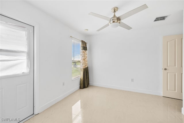 3206 8th St SW, Lehigh Acres, FL 33976 - spare room with ceiling fan and baseboards