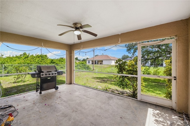 3206 8th St SW, Lehigh Acres, FL 33976 - unfurnished sunroom featuring a ceiling fan