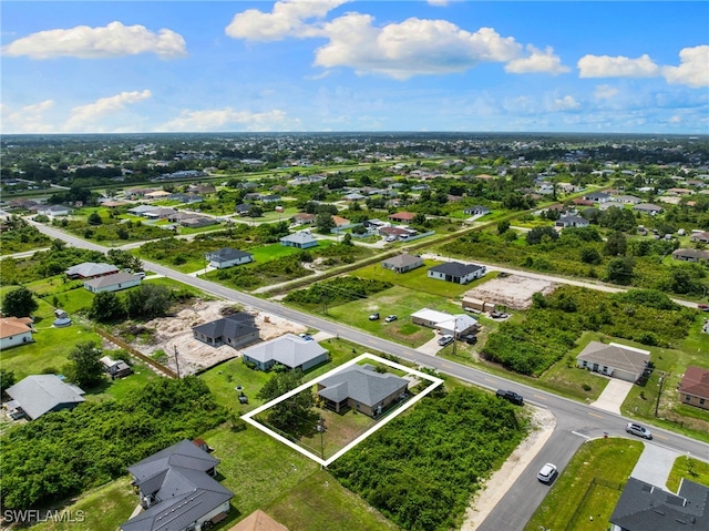 3206 8th St SW, Lehigh Acres, FL 33976 - aerial perspective of suburban area with property boundaries highlighted