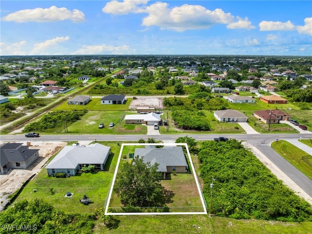 3206 8th St SW, Lehigh Acres, FL 33976 - aerial perspective of suburban area with property parcel outlined