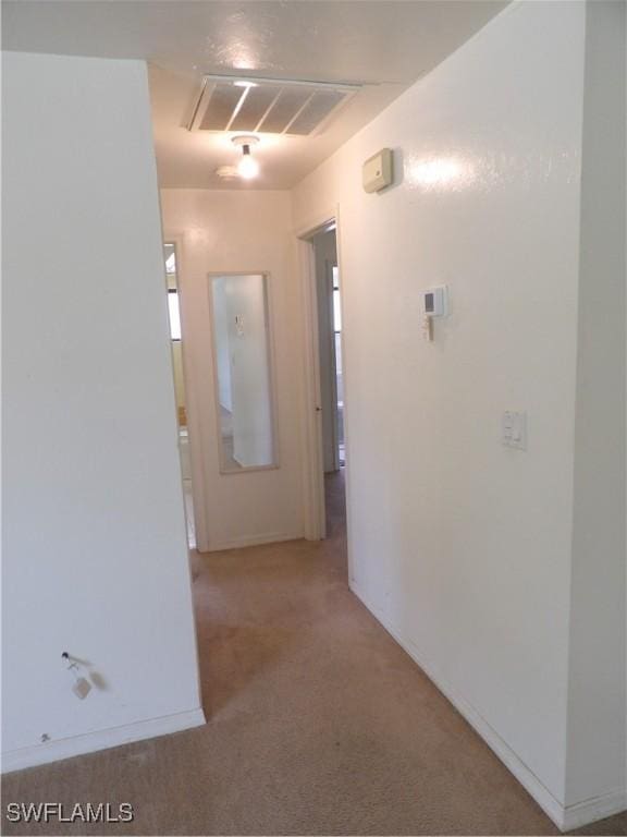 4807 6th St W, Lehigh Acres, FL 33971 - hall with carpet flooring and attic access