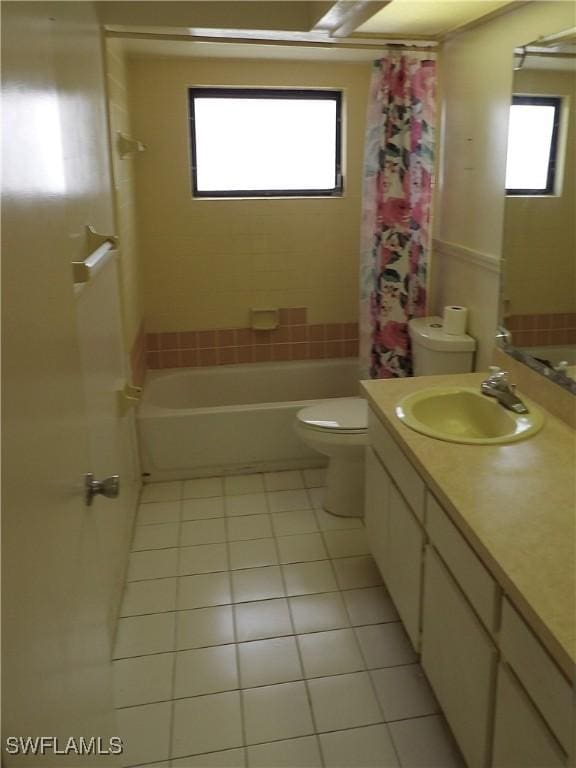 4807 6th St W, Lehigh Acres, FL 33971 - full bathroom featuring tile patterned flooring, vanity, and shower / bath combo with shower curtain