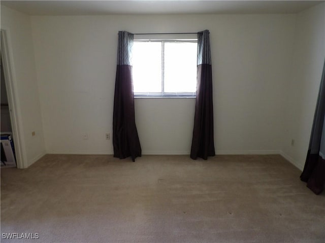 4807 6th St W, Lehigh Acres, FL 33971 - empty room with light colored carpet and baseboards