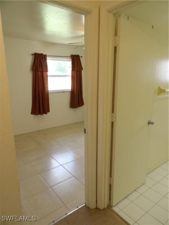 4807 6th St W, Lehigh Acres, FL 33971 - hall featuring light tile patterned floors