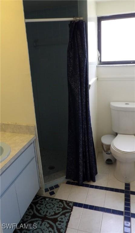 4807 6th St W, Lehigh Acres, FL 33971 - full bathroom featuring vanity, tile patterned flooring, and a shower stall