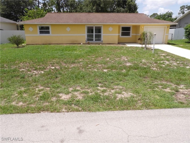 4807 6th St W, Lehigh Acres, FL 33971 - ranch-style house with driveway, an attached garage, and stucco siding