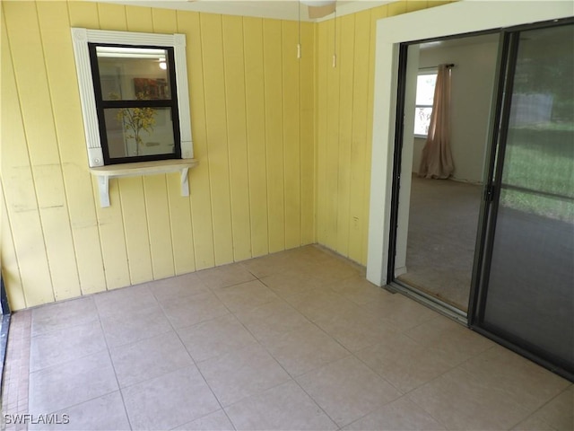 4807 6th St W, Lehigh Acres, FL 33971 - empty room with wooden walls and light tile patterned floors