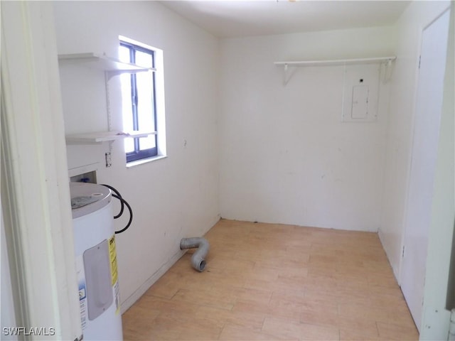 4807 6th St W, Lehigh Acres, FL 33971 - laundry room with electric water heater, hookup for a washing machine, and light wood-type flooring