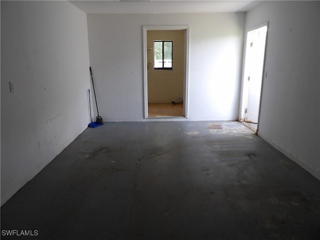 4807 6th St W, Lehigh Acres, FL 33971 - empty room featuring unfinished concrete flooring