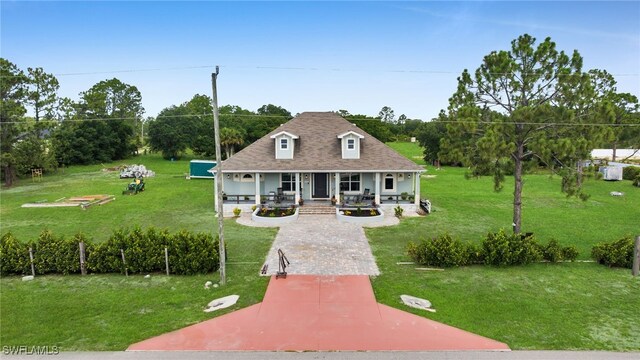 9785 Wheeler Rd, Labelle, FL 33935 - back of house featuring covered porch and a yard