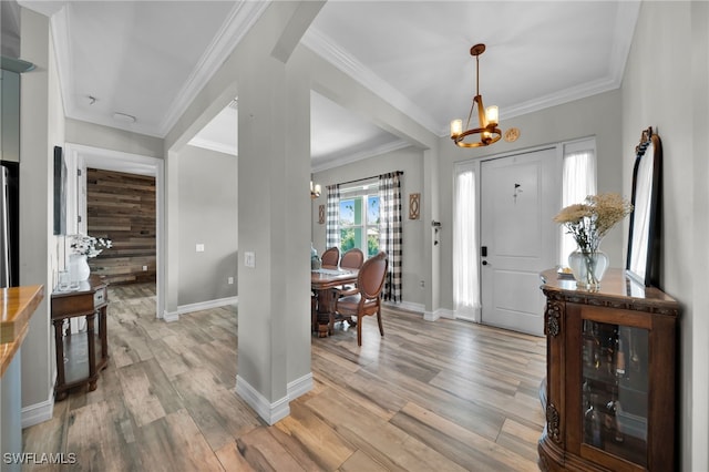 9785 Wheeler Rd, Labelle, FL 33935 - foyer entrance featuring a chandelier, light wood-style flooring, and crown molding