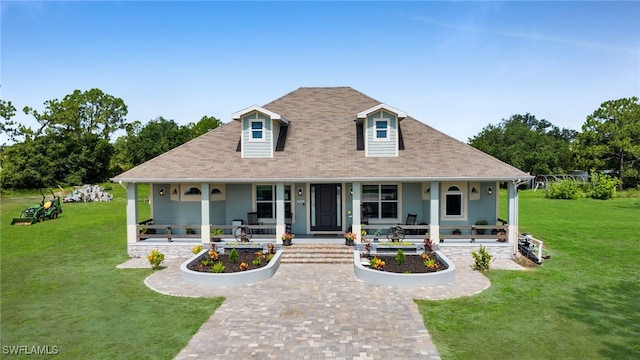 9785 Wheeler Rd, Labelle, FL 33935 - country-style home featuring a porch, a front yard, a shingled roof, and decorative driveway
