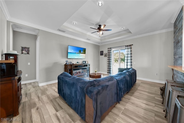 9785 Wheeler Rd, Labelle, FL 33935 - living area with light wood-style floors, a ceiling fan, crown molding, and a raised ceiling