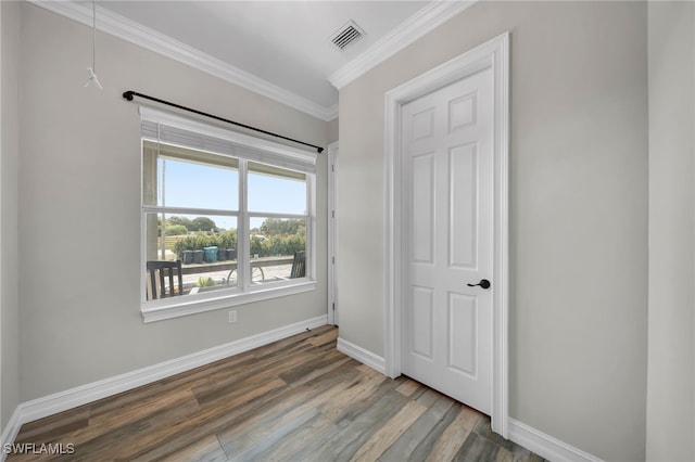 9785 Wheeler Rd, Labelle, FL 33935 - unfurnished bedroom with ornamental molding and wood finished floors