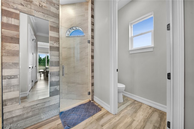 9785 Wheeler Rd, Labelle, FL 33935 - bathroom with a tile shower, plenty of natural light, and wood finished floors