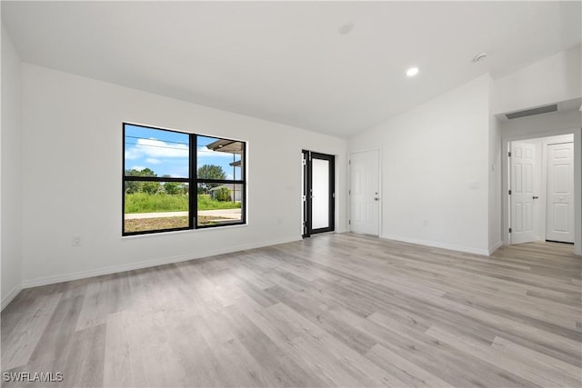 2912 8th St W, Lehigh Acres, FL 33971 - spare room featuring light wood finished floors, high vaulted ceiling, and recessed lighting